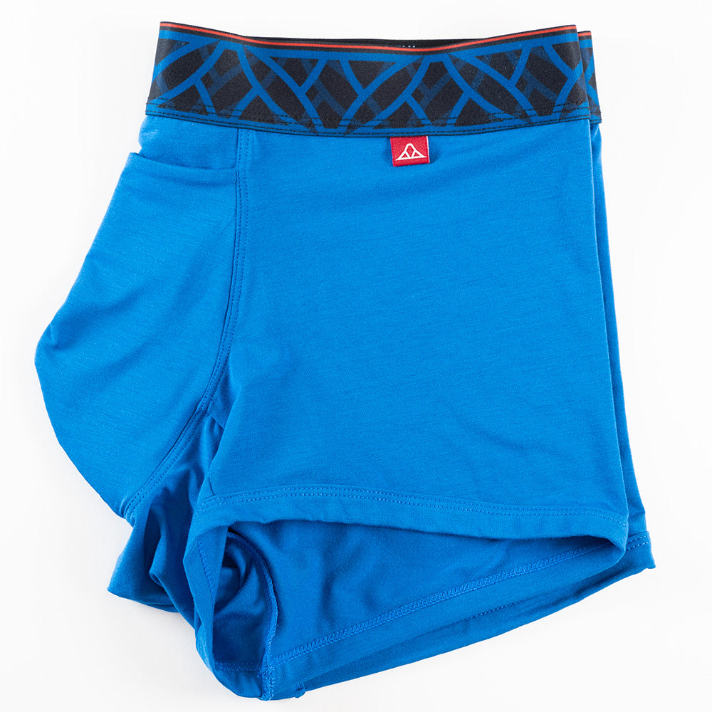 Blue men's trunks featuring a contoured Pouch for support with a fly, a black patterned waistband. and a 2" inseam. Side Image.