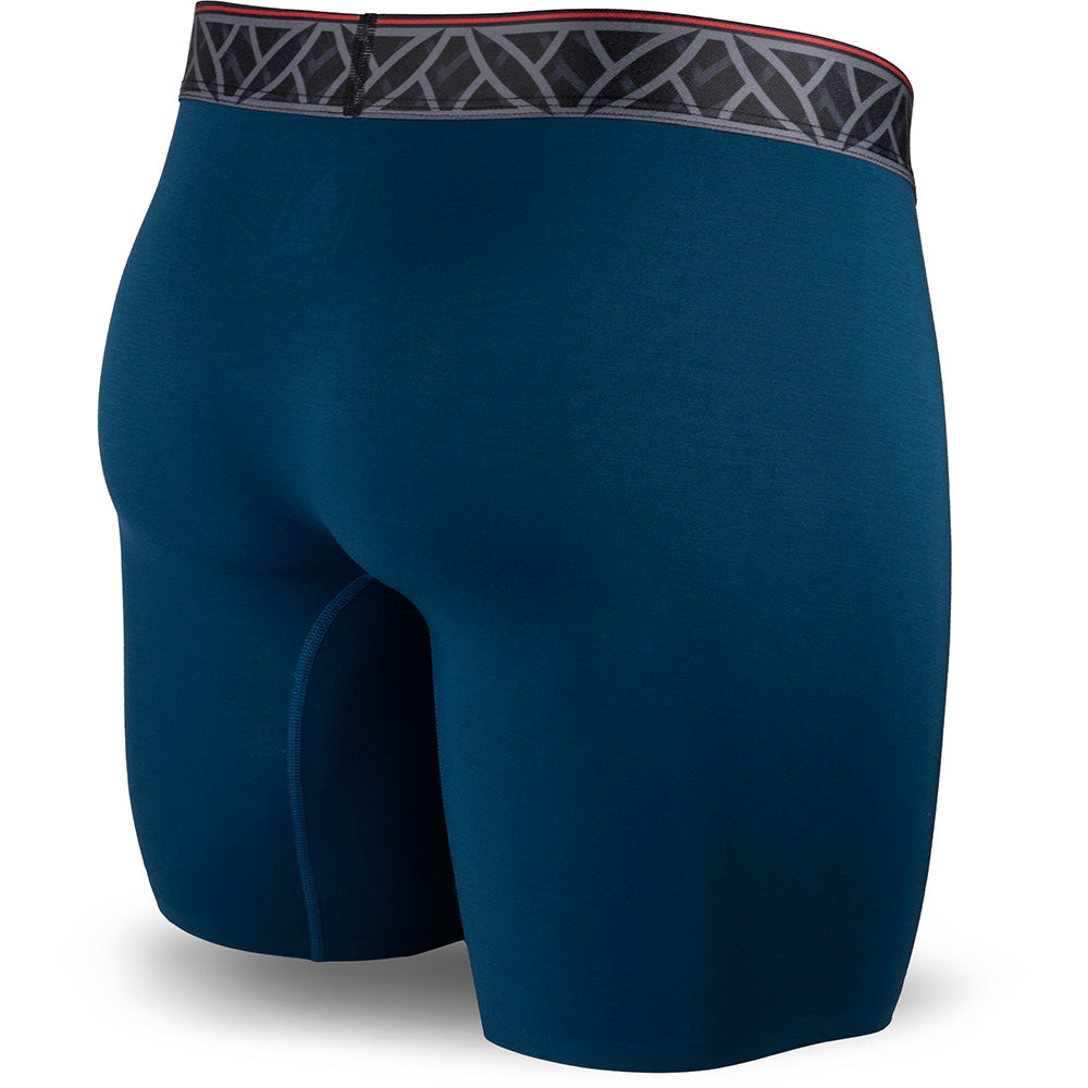 Blue athletic shorts with a patterned waistband on a white background