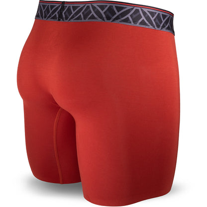 Red athletic shorts with a patterned waistband on a white background