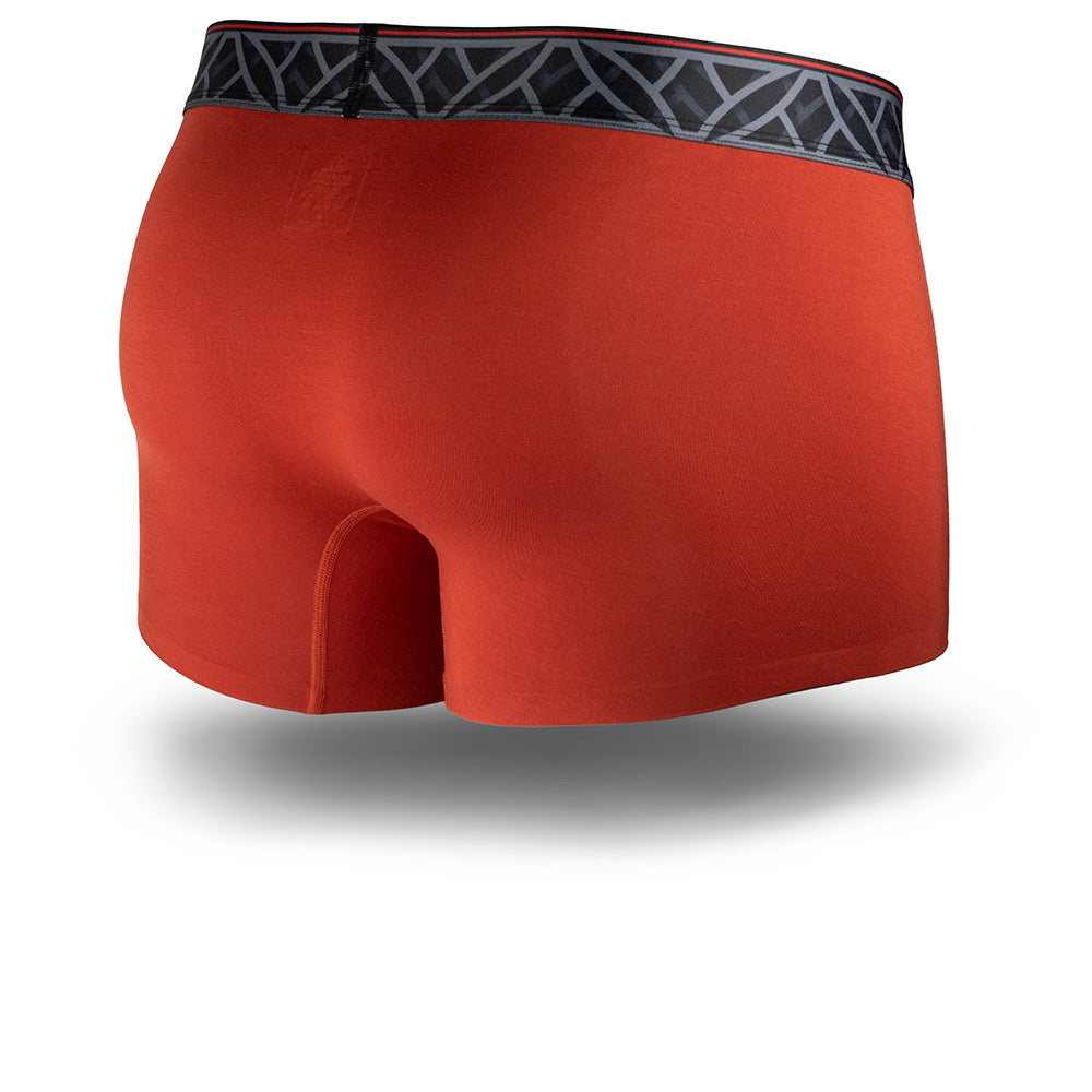 Red boxer briefs with a patterned waistband on a white background