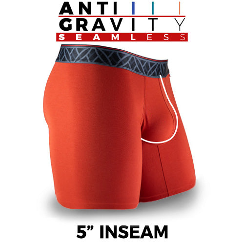 Red athletic shorts with a black waistband on a white background, featuring 'Anti Gravity Seamless' text.