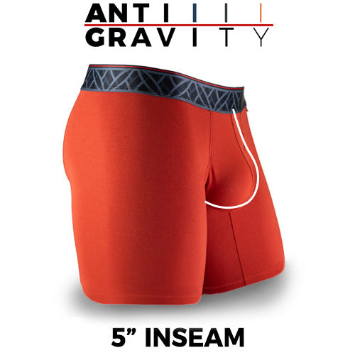 Red athletic shorts with a black waistband on a white background, featuring 'Anti Gravity' text.