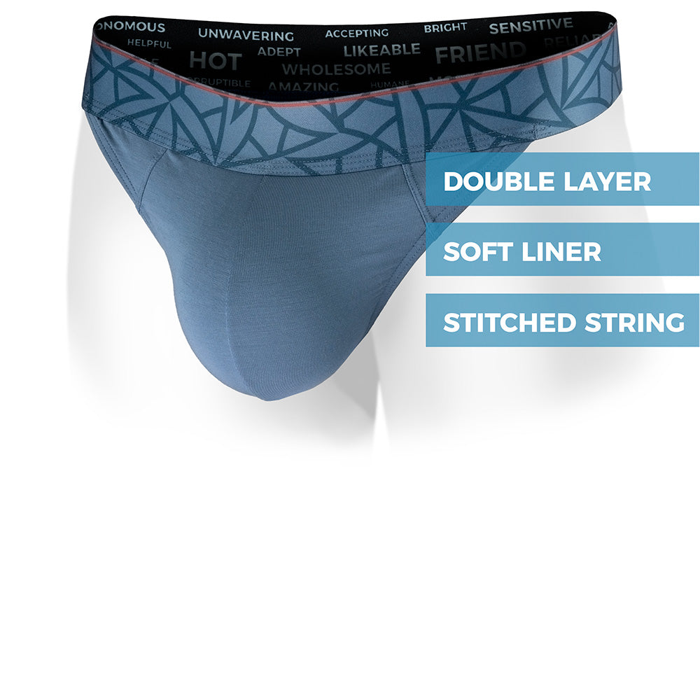 Wailea Blue Haleakala Thong with a patterned waistband on a white background. Front view.