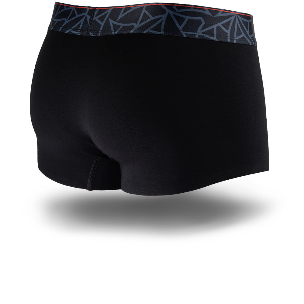 Black men's trunks featuring a contoured Pouch with mesh liner for support without a fly, patterned waistband, seamless hems and a 1.5" inseam. Back Image.