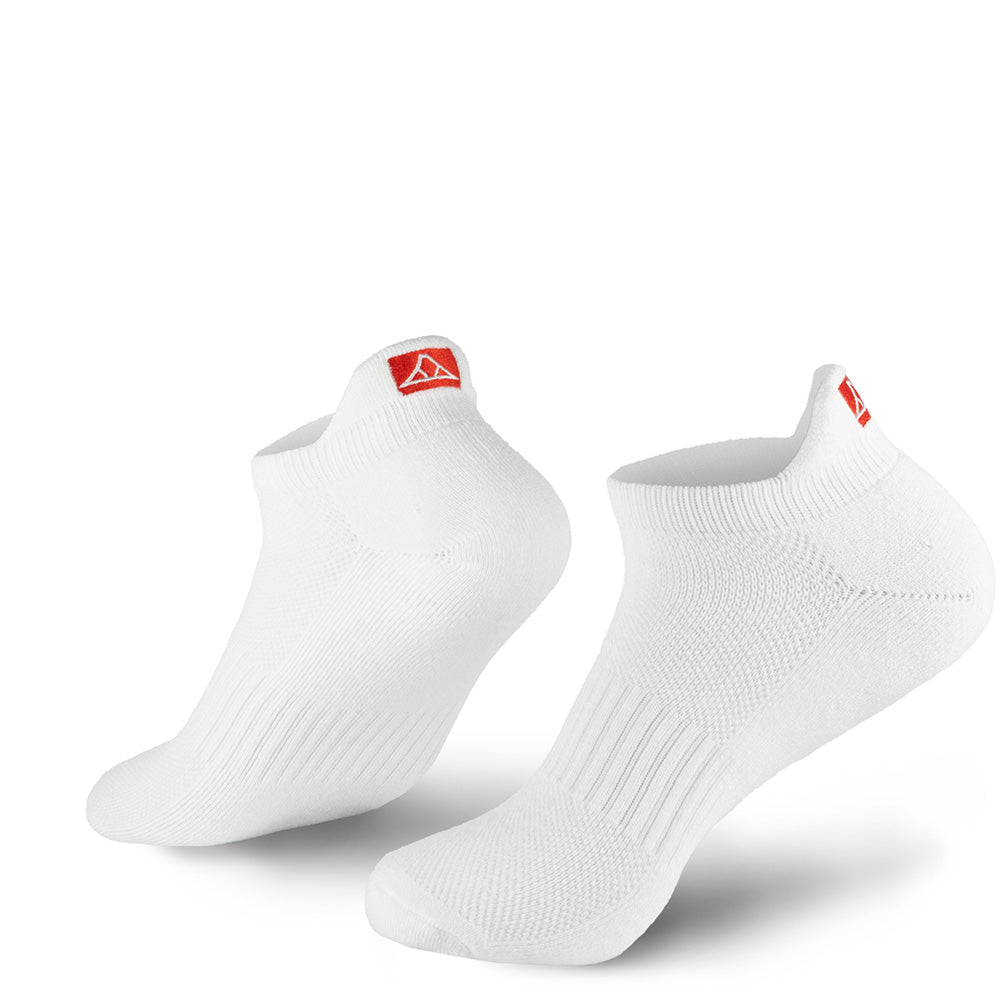 White no-show socks with red Krakatoa logo on the back flap, on a white background