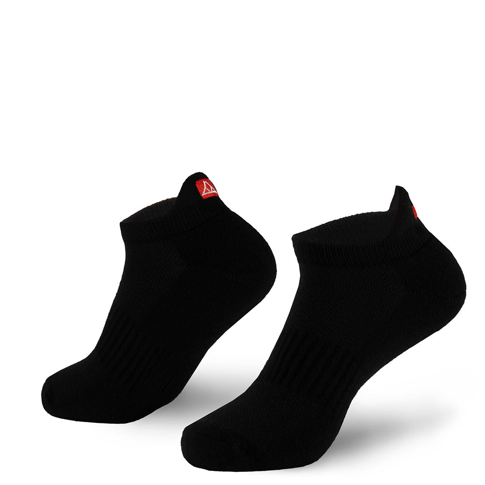 Black no-show socks with red Krakatoa logo on the back flap, on a white background