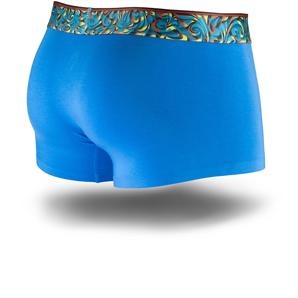 Blue men's trunks featuring a contoured "Caldera Pouch" for support, a teal and orange patterned waistband, and a 1.5" inseam. Back Image.