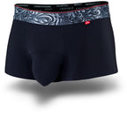 Black men's trunks featuring a contoured "Caldera Pouch" for support, a grey patterned waistband, and a 1.5" inseam. Front Image.