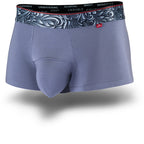 Grey men's trunks featuring a contoured "Caldera Pouch" for support, a grey patterned waistband, and a 1.5" inseam. Front Image.