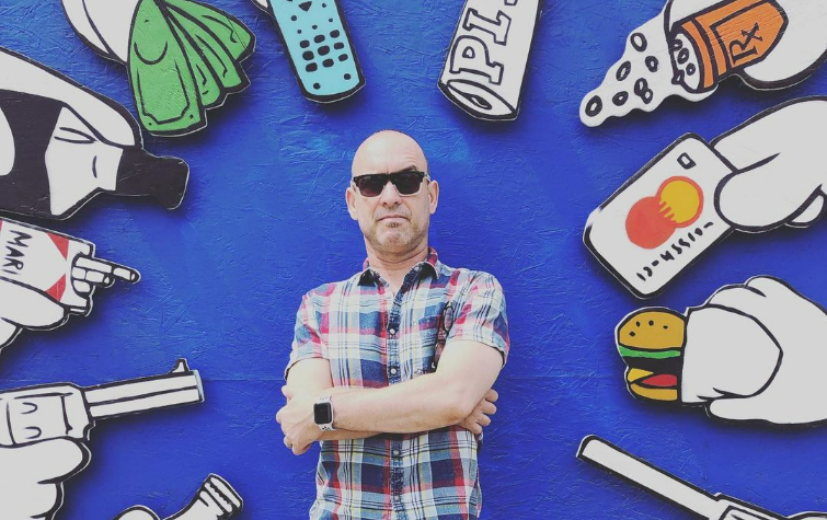 Alex on blue background and sunglasses